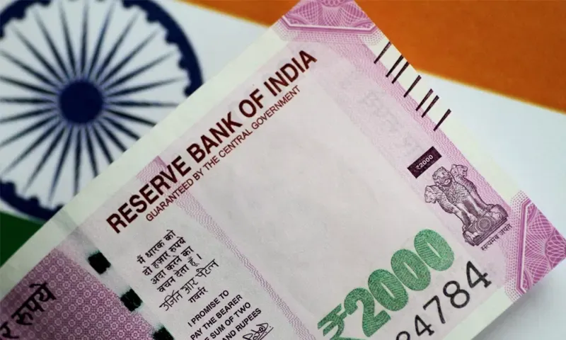 Indian rupee closes all-time low as crude prices rise