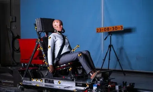 Women in the driver's seat with female crash test dummy