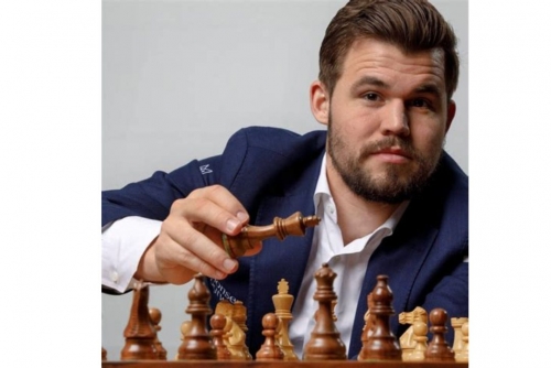 Chess legend Carlsen puts ‘forbidden jeans’ up for auction 