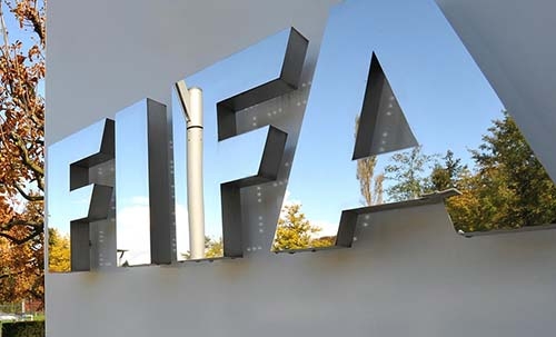 Court backs ex-FIFA official in Qatar slur case