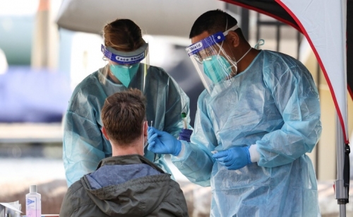 Australia borders to stay shut as COVID-19 daily deaths reach record