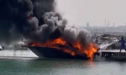 Boat catches fire in Sitra killing elderly woman