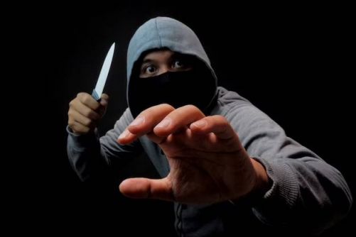 Masked man caught after petrol attack on currency exchange and theft of thousands in cash