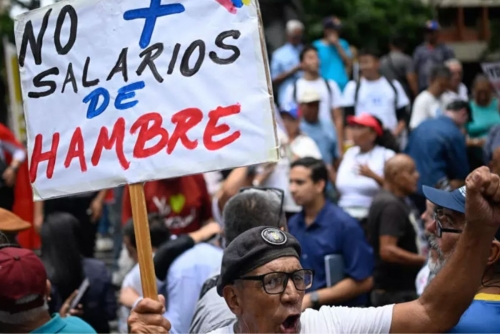 Venezuelan protesters call government wage hike a joke