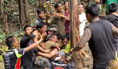 Laos cave survivors walk out after 11 days trapped underground