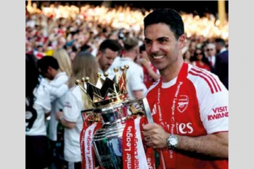 Arsenal head coach Mikel Arteta with the Premier League trophy Arsenal head coach Mikel Arteta with the Premier League trophy