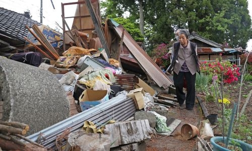 Aftershocks shake Japan after quake kills one, destroys homes