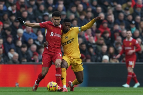 Liverpool edge Wolves to extend lead