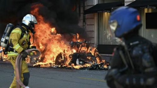 Protesters set Tesla ablaze, damage UN building in Geneva Protesters set Tesla ablaze, damage UN building in Geneva