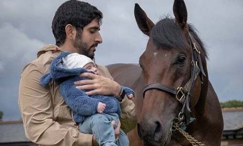 Sheikh Hamdan introduces 3-month-old twins to champion horse Sheikh Hamdan introduces 3-month-old twins to champion horse