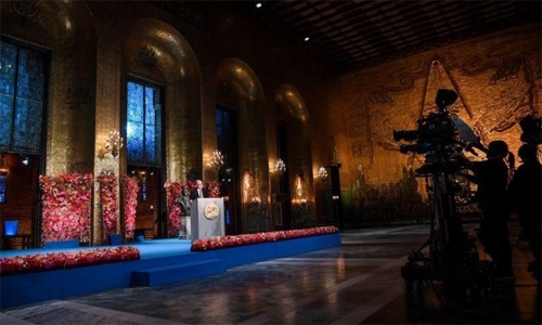 Nobel winners get prizes at home while the socially distanced band plays