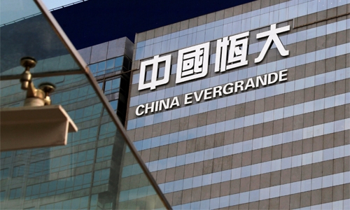 What is the ongoing crisis at one of China's biggest companies Evergrande?