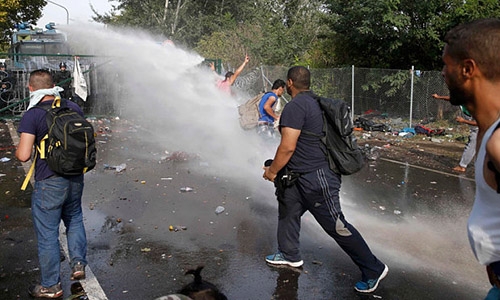 Hungary charges Syrian with 'terrorism' after border riot Hungary charges Syrian with 'terrorism' after border riot