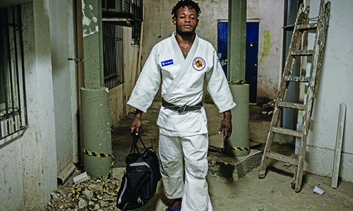 Refugee fights way into Olympics Refugee fights way into Olympics