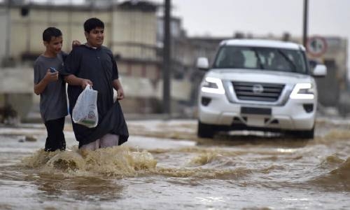 Saudi storm kills two, closes schools and cuts road to Mecca