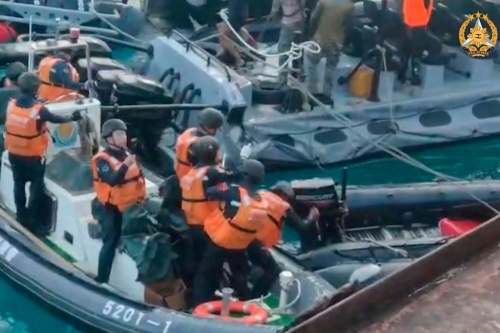 Chinese sailors wield sticks, axe in disputed sea clash with Philippines