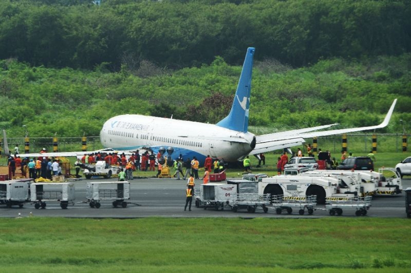 Plane slides off Manila runway causing delays