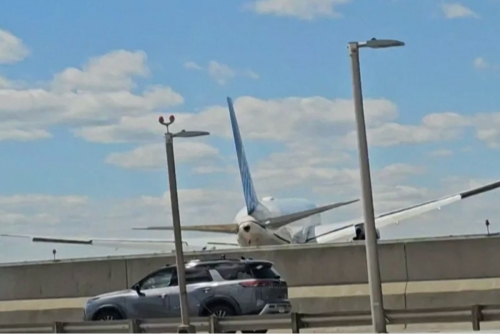 Passenger jet clips lamppost, truck while landing at Newark. Passenger jet clips lamppost, truck while landing at Newark.