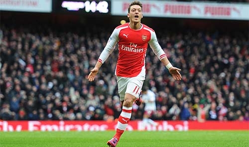 Inspired Ozil fires Arsenal to top spot Inspired Ozil fires Arsenal to top spot