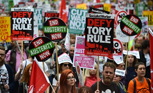 Tens of thousands in London march against PM, austerity Tens of thousands in London march against PM, austerity