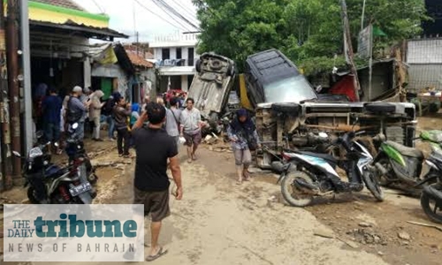 Indonesia rescuers hunt for missing after flood kills 43