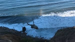 Woman falls off 100ft cliff while looking at her phone