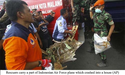 Plane crashes into home; four dead Plane crashes into home; four dead