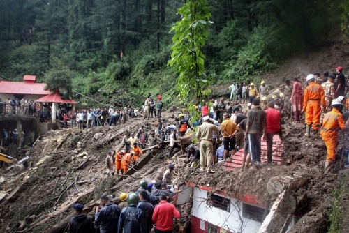 Search for survivors after Indian floods, landslides kill 65