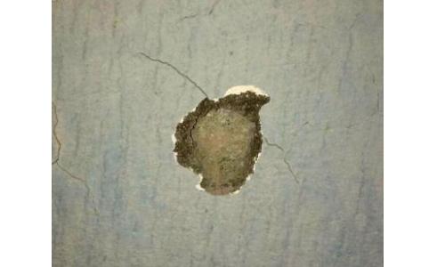 Terrorist explosion damages school wall Terrorist explosion damages school wall