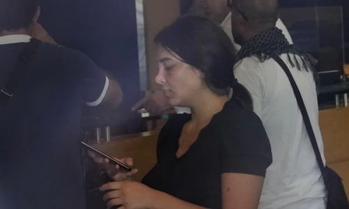 woman with toy gun grabs her savings from Beirut bank