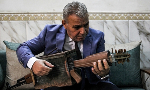 Iraqi transforms Kalashnikov into musical instrument Iraqi transforms Kalashnikov into musical instrument