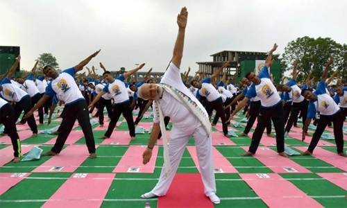 Millions stretch and bend for International Yoga Day