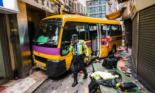 Four killed as Hong Kong schoolbus mounts pavement Four killed as Hong Kong schoolbus mounts pavement