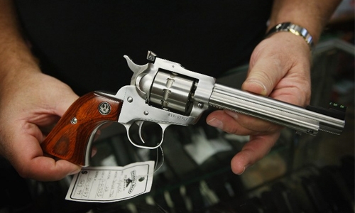 Three jailed for possessing gun