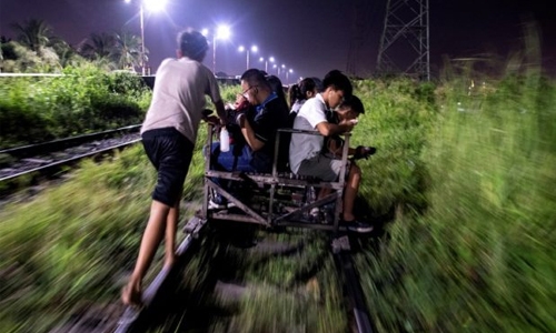 Dodging traffic and death on Manila’s railway carts