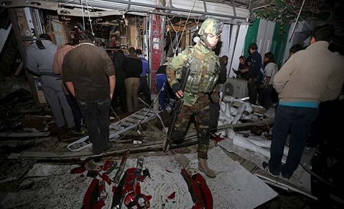 IS-claimed suicide attack kills 7 in Iraq café