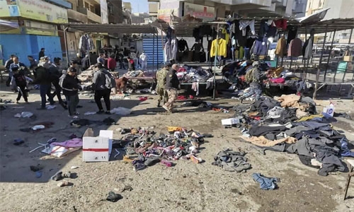 Deadly twin suicide blasts rock Baghdad market