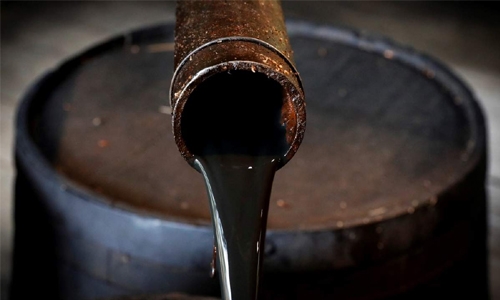 Oil prices slip toward 18-month lows ahead of New Year