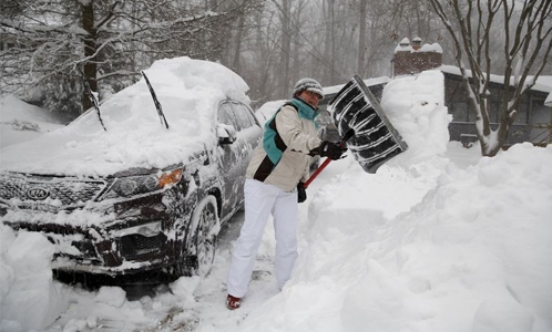 Americans begin digging out as historic blizzard winds down