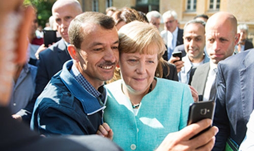 Syrian refugee bus heads across Germany to Merkel's office