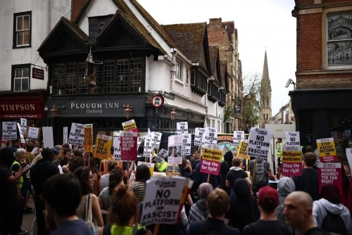 Protesters Rally in Oxford Over Tommy Robinson Islam Debate