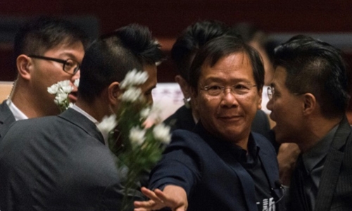 HK lawmakers dragged from chamber