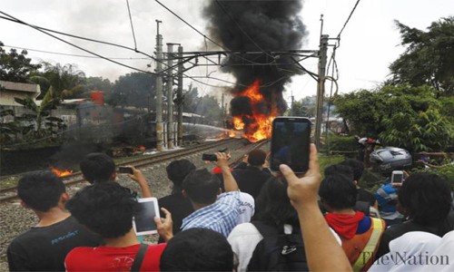Bus and train crash in Indonesia kills 16 Bus and train crash in Indonesia kills 16