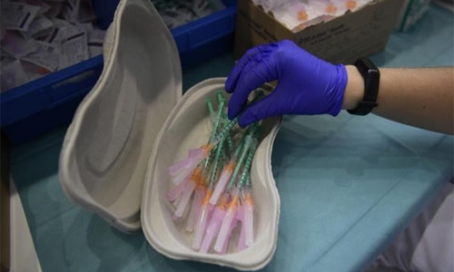 WHO chief urges countries with large supplies of vaccines to halt booster shots