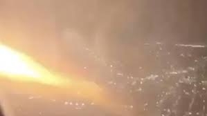 US flight returns to airport after flames seen by wing