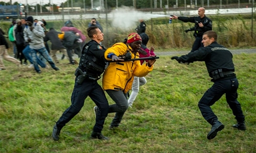 Police 'routinely' use pepper spray on migrants in Calais Police 'routinely' use pepper spray on migrants in Calais