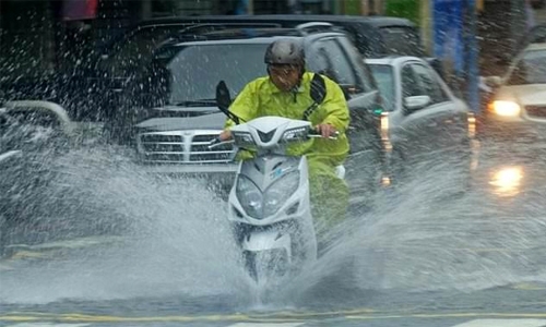 Taiwan battles floods as torrential rain hits
