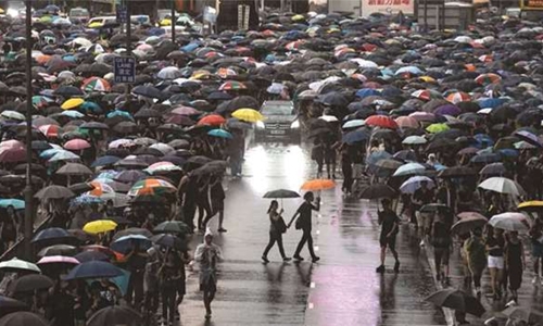 Hong Kong protesters flood city streets