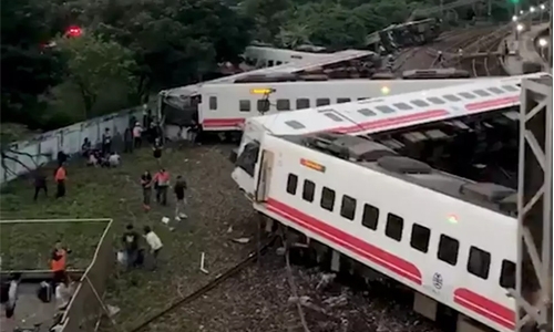 17 dead after train flips in Taiwan 17 dead after train flips in Taiwan