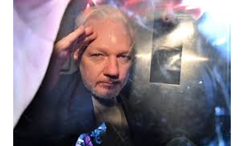 UK minister signs US bid to extradite Assange